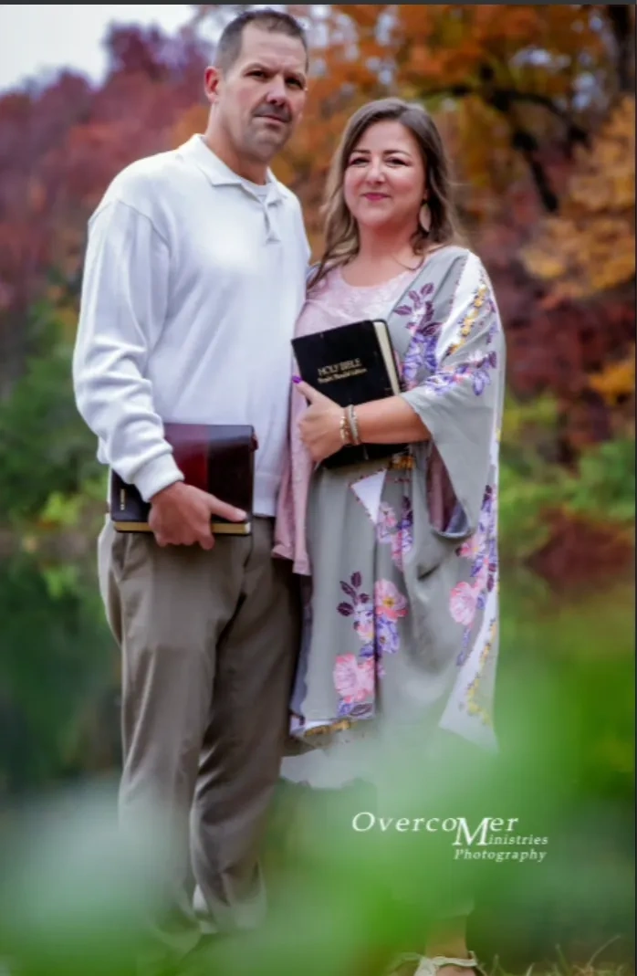 Couple holding Bibles outdoors in autumn — Road to Damascus ministry